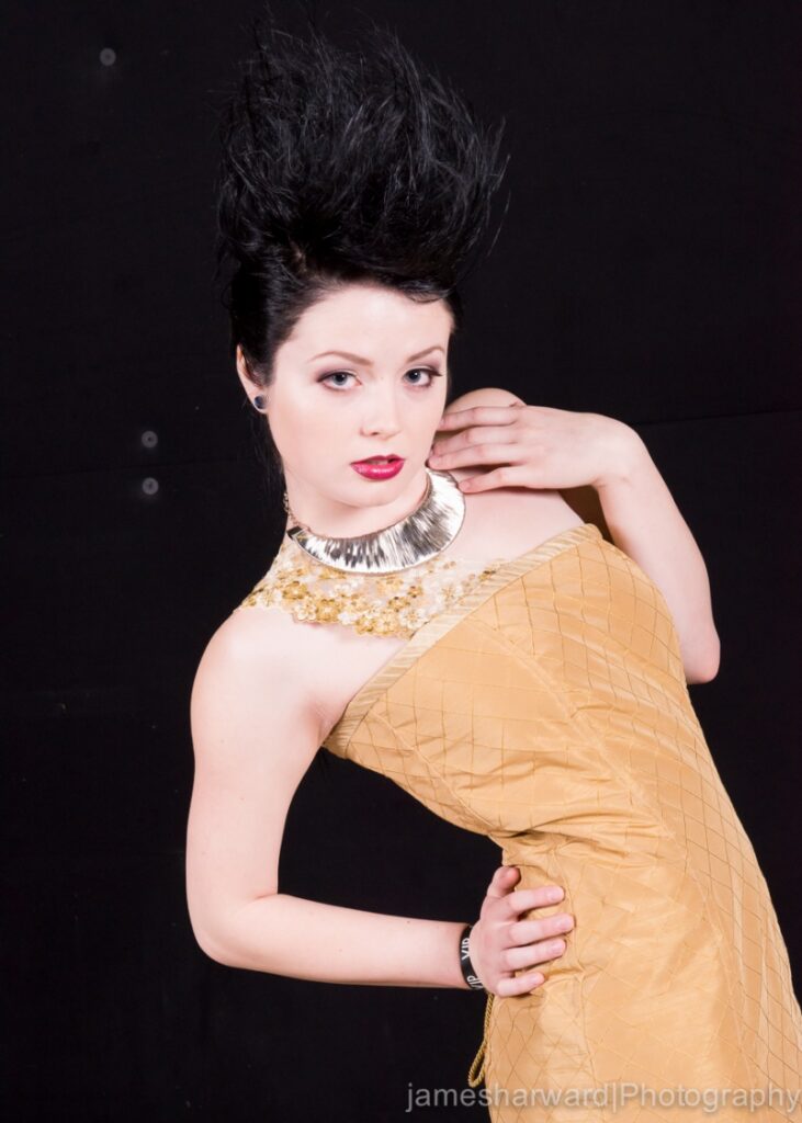 Deven Skye in gold couture with sculpted hair