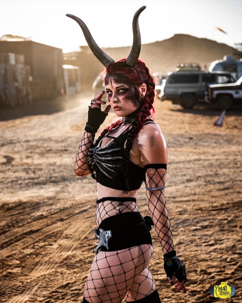 Deven Skye in horns and fishnets in the desert